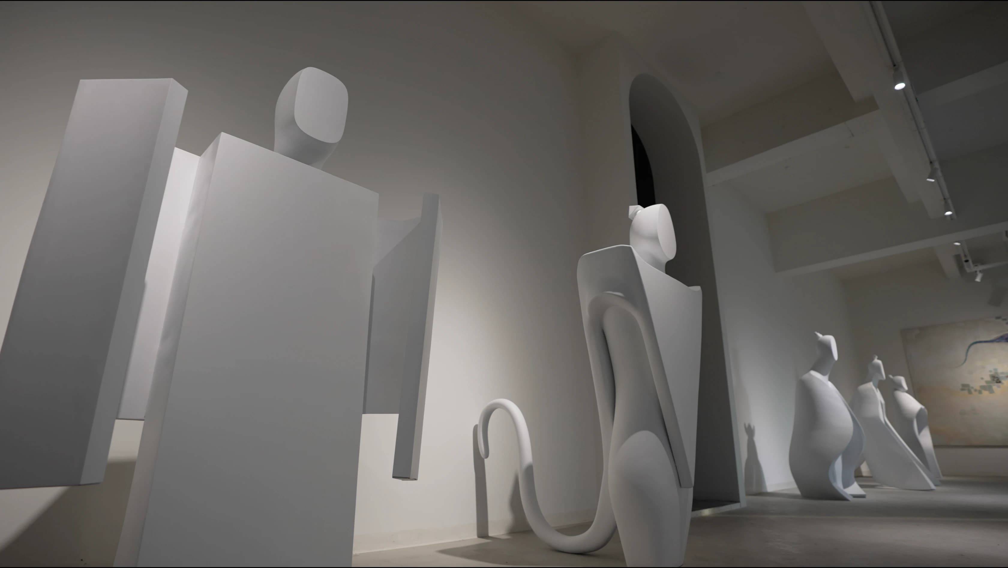 Five Element Deities installation with five white mythic figures in an interior